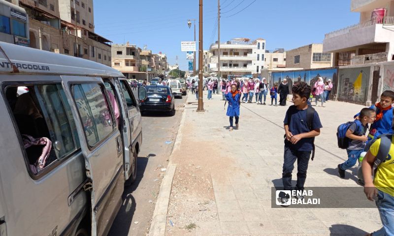 من أمام مدارس المحطة في حي الكاشف بمدينة درعا- 12 أيلول 2023 (عنب بلدي)