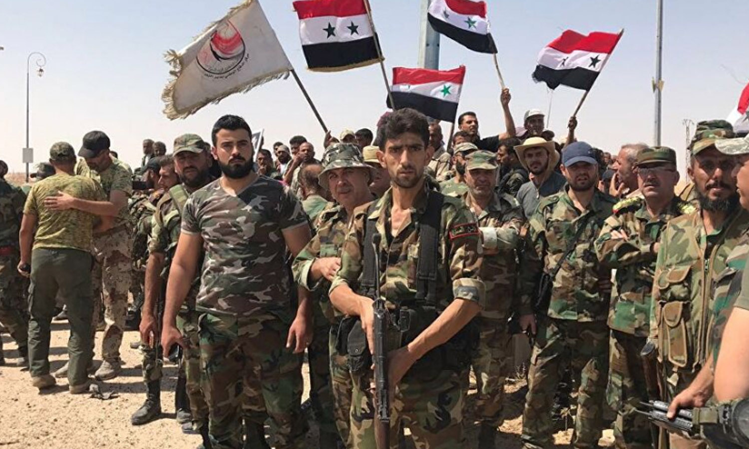 مقاتلون من ميليشيا الدفاع الوطني الرديفة بقوات النظام السوري في محافظة درعا جنوبي سوريا (سبوتنيك)