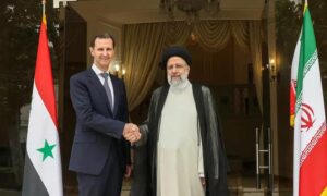 آخر زيارة لرئيس النظام السوري بشار الأسد إلى طهران ولقائه مع الرئيس الإيراني السابق إبراهيم رئيسي- أيار 2022 (AFP)