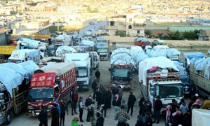 شاحنات تستعد لنقل سوريين من لبنان لسوريا- أيار 2024 
(AFP)