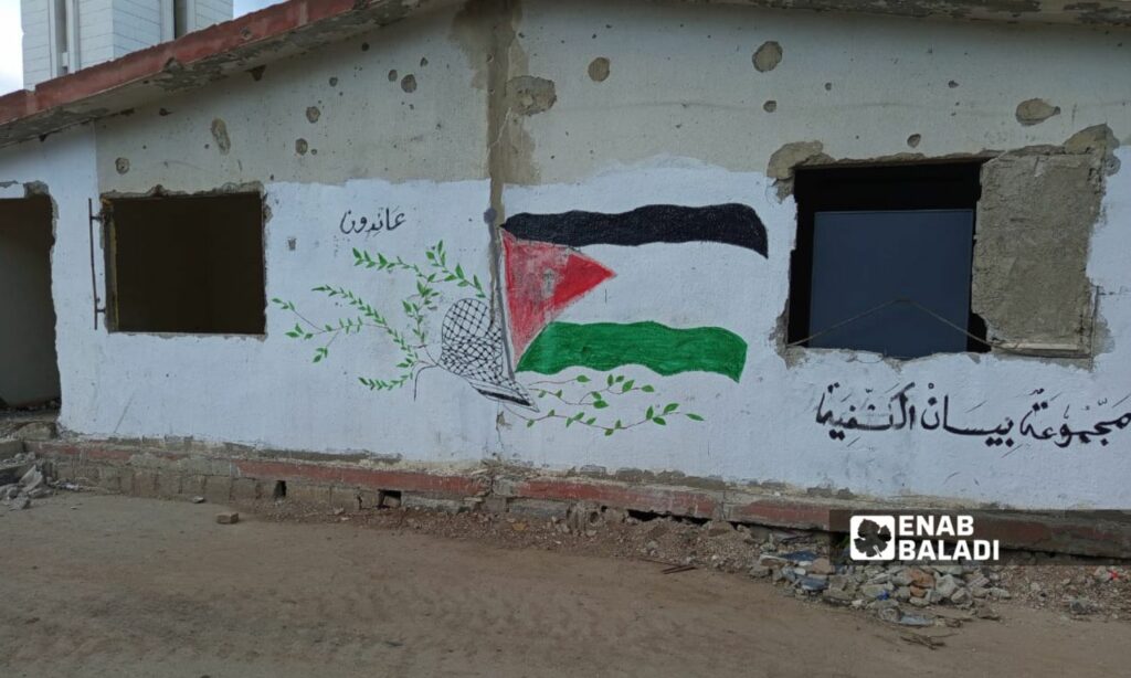 جدارية في مدخل مخيم "اليرموك" للاجئين الفلسطينيين في سوريا 20 شباط (عنب بلدي-بيسان خلف)