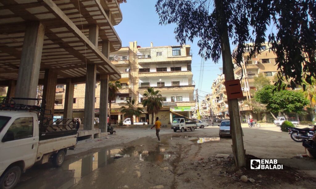 انتشار الغبار والردميات في أحد شوارع مدينة داريا