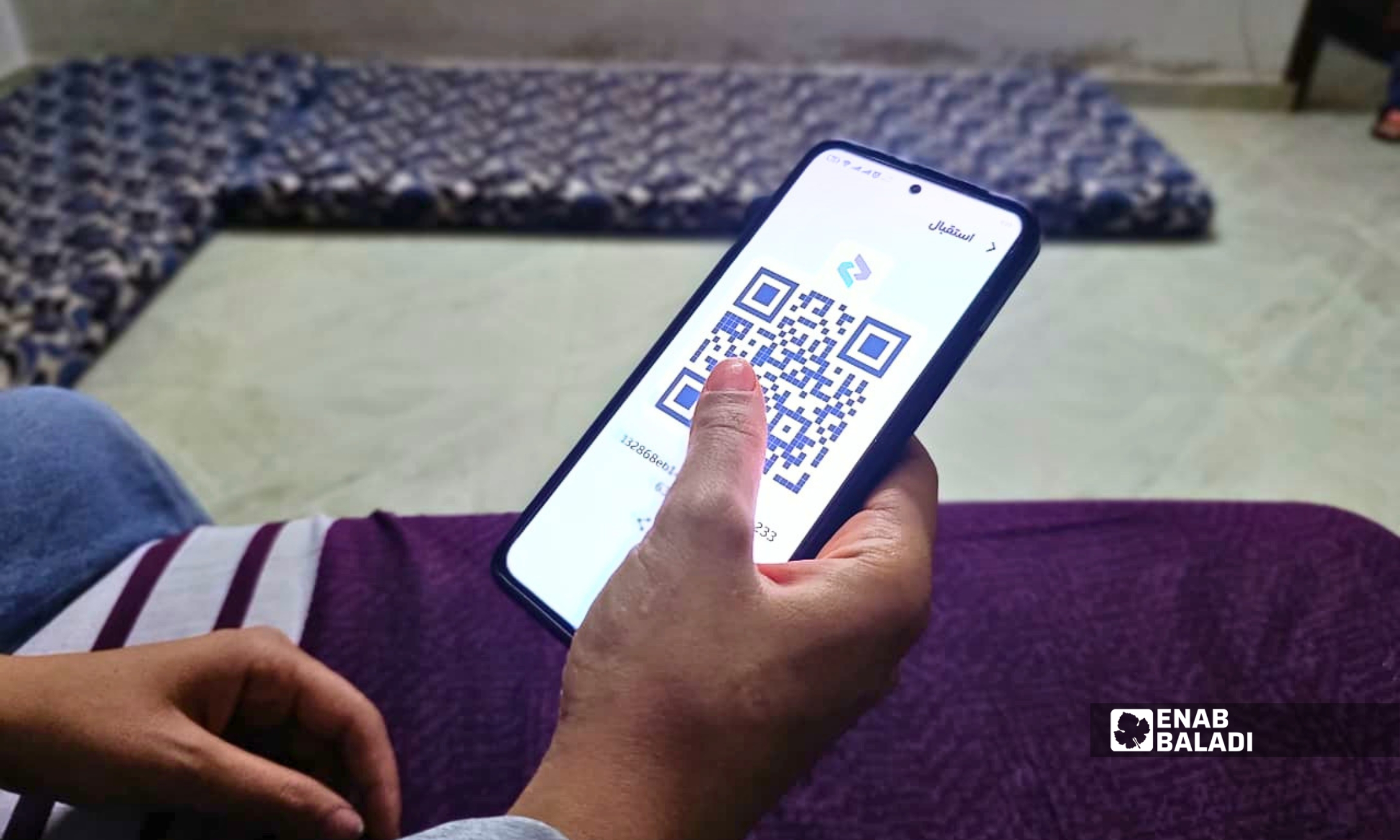 واجهة تطبيق «شام كاش» على هاتف محمول