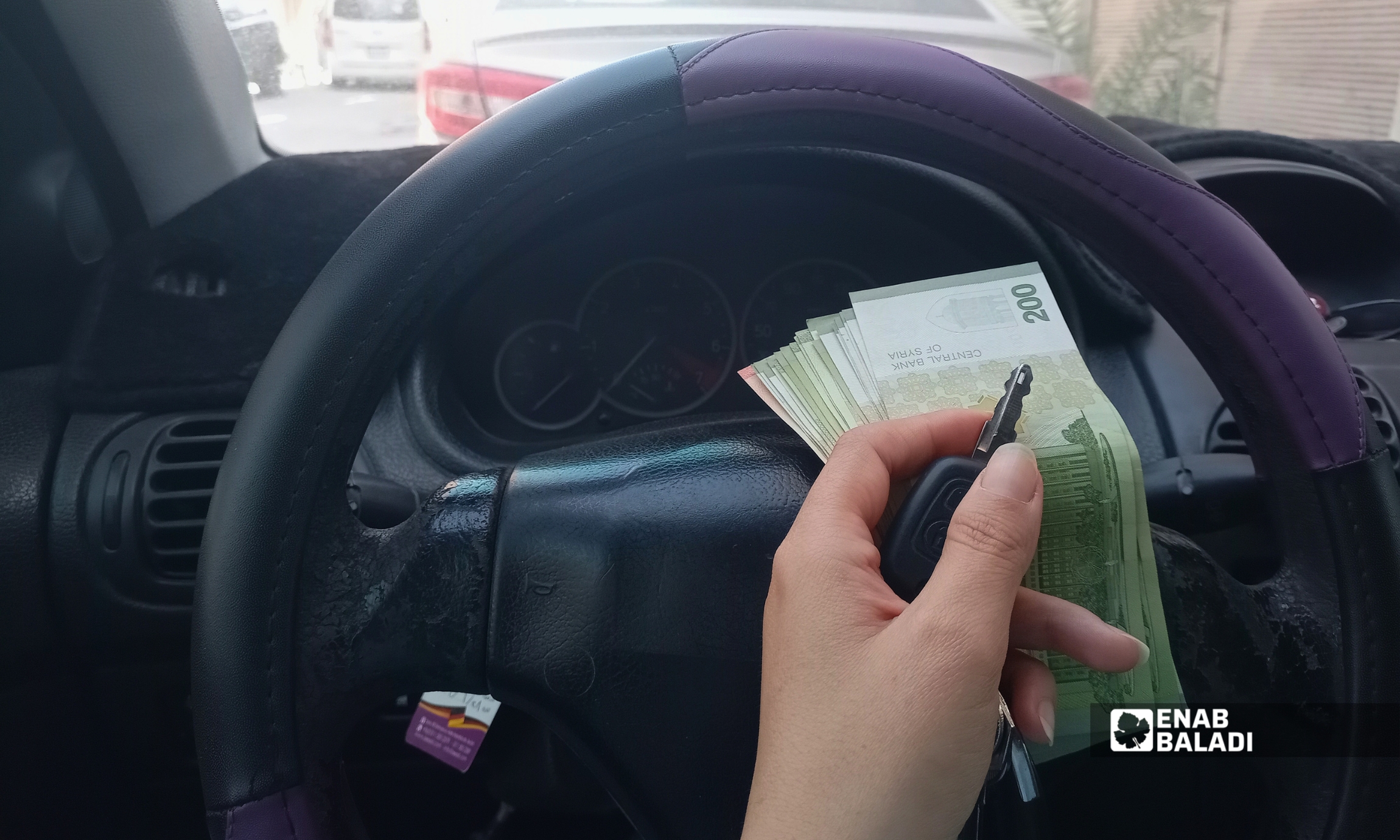 سيارات مركونة في أحد شوارع مدينة داريا