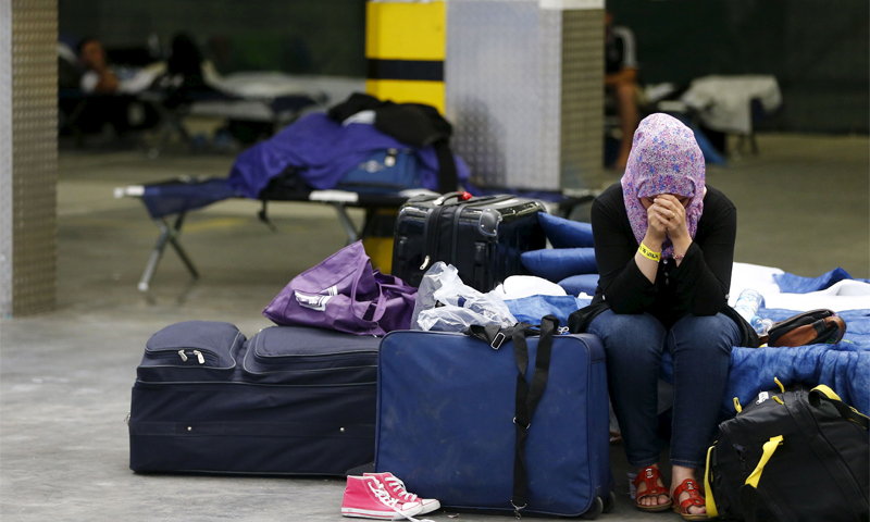 (A woman crying at the Refugee Registration Center in Frankfurt, Germany, September, 2015 – Reuters)