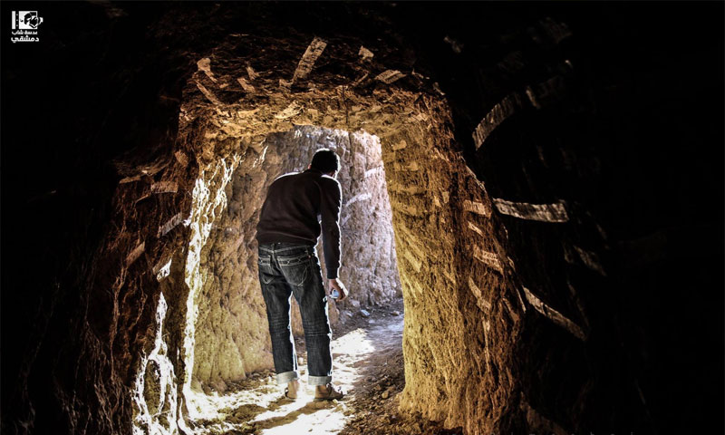 A young man walks through a tunnel used for military operations in Daraya, in the Damascus countryside on December 8. Photo by Lens of A Young Damascene Man