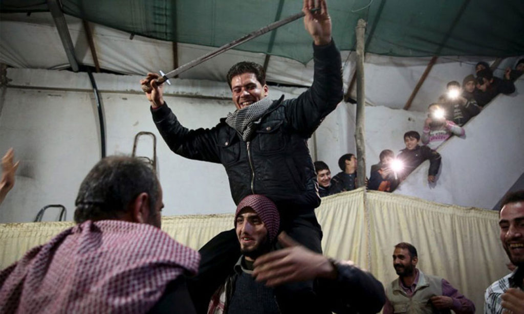 Wedding of a Free Army fighter in the city of Douma in Rif Dimashq province, March 15 (Reuters)v