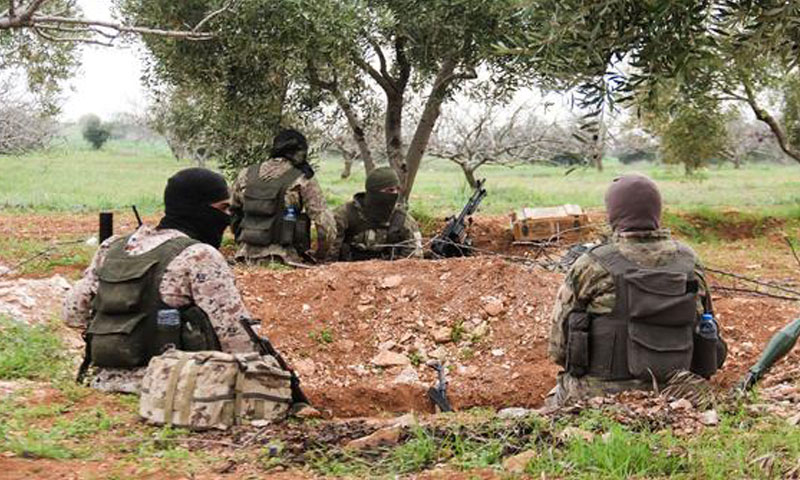 Hay’at Tahrir al-Sham fighters in the town of Maardes, northern countryside of Hama - 22 March 2017 (AFP)