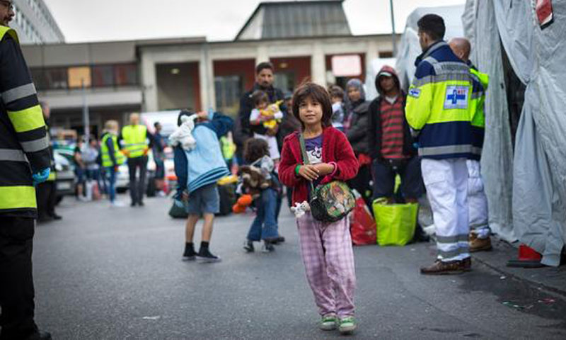 Refugees at the temporary headquarters of a concerned association in Berlin - 7 September 2015 (UNHCR)