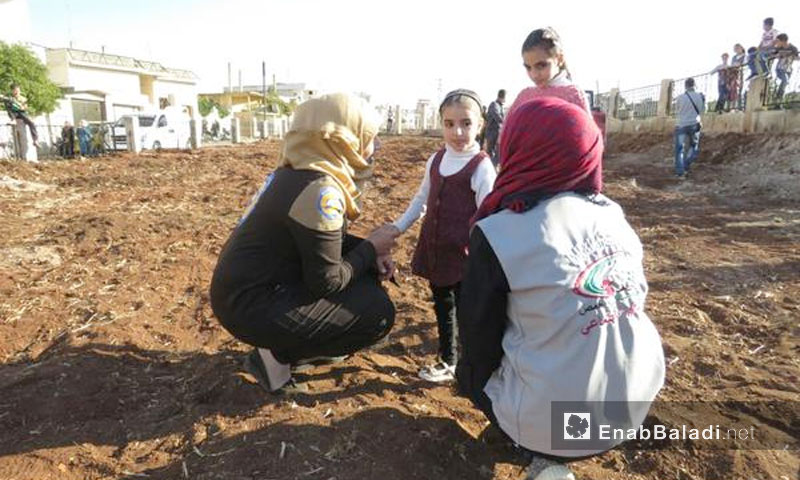 Expressive image: The preparation of a playground for the children of the city of al-Rastan north of Homs by “Our Children" volunteer team - 10 November 2017 (Enab Baladi)