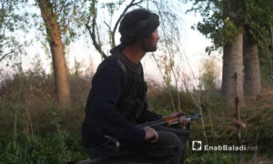 A Syrian opposition fighter in the Bala farms in eastern Ghouta- (Enab Baladi Archives)