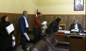 A judge working on a divorce case in the Sharia Court in Damascus - 6 March 2016