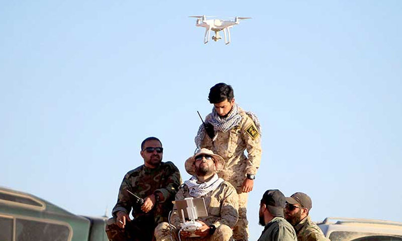 Members of the Iraqi “Harakat Hezbollah al-Nujaba” directing a drone at the Syrian-Iraqi borders – (Mehr News Agency)