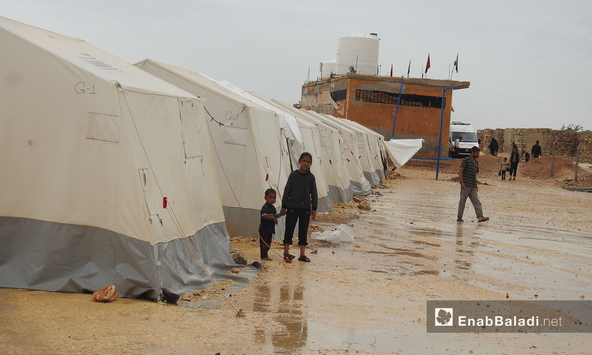 People displaced from Eastern Ghouta after the rainfall in the al-Bal camp in the northern countryside of Aleppo – May 22, 2018 (Enab Baladi)