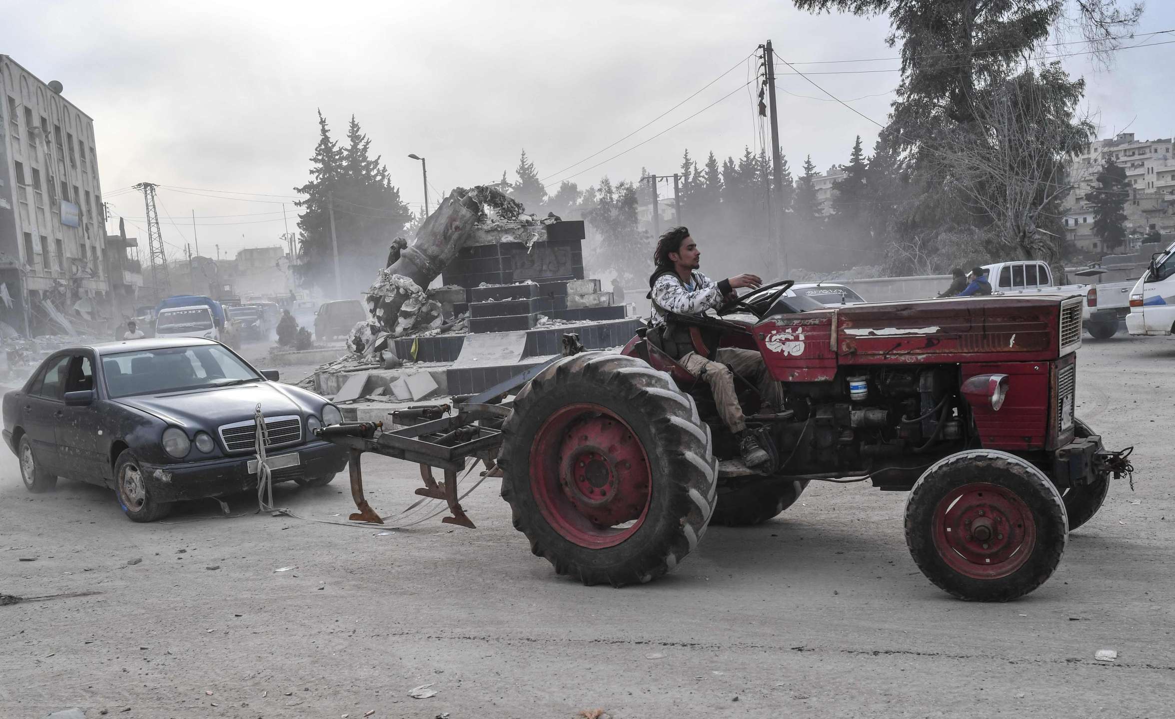 Free army fighters looting cars and furniture from Afrin (AFP)