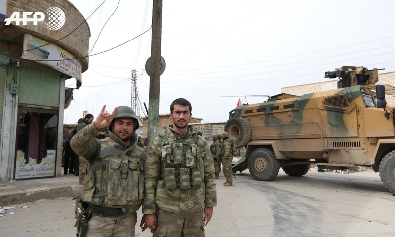 Turkish army members in Afrin northern Aleppo after controlling it - 18 March 2018 (AFP)