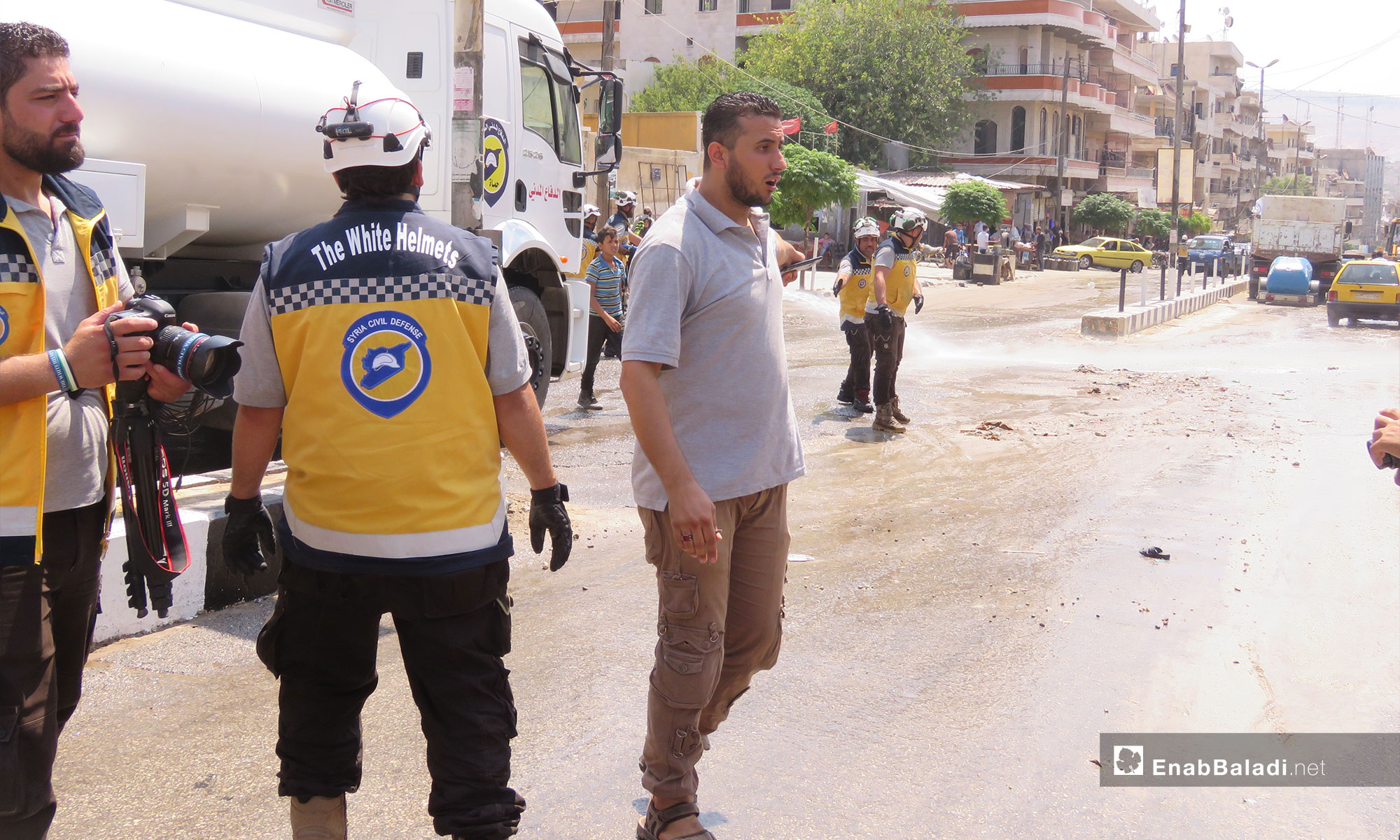   Civil Defense members in a campaign for the rehabilitation of roads in Afrin city – August 1, 2018 (Enab Baladi)