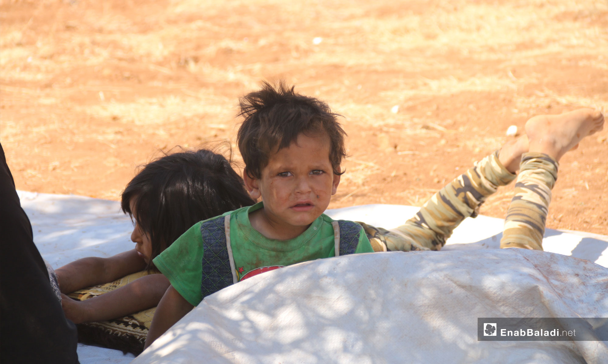 Child displaced from rural Idlib due to shelling to the town of Sarman near the Turkish supervision point in Idlib – September 12, 2018 (Enab Baladi)