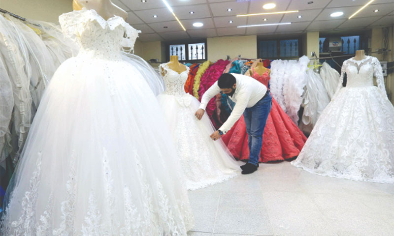 A wedding dresses merchant in Damascus – January 8, 2018 (AFP)