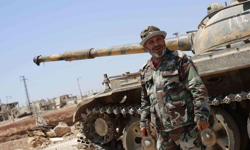 A colonel of Assad’s forces on the military fronts in al-Rastan, rural Homs – July 2018 (AP)