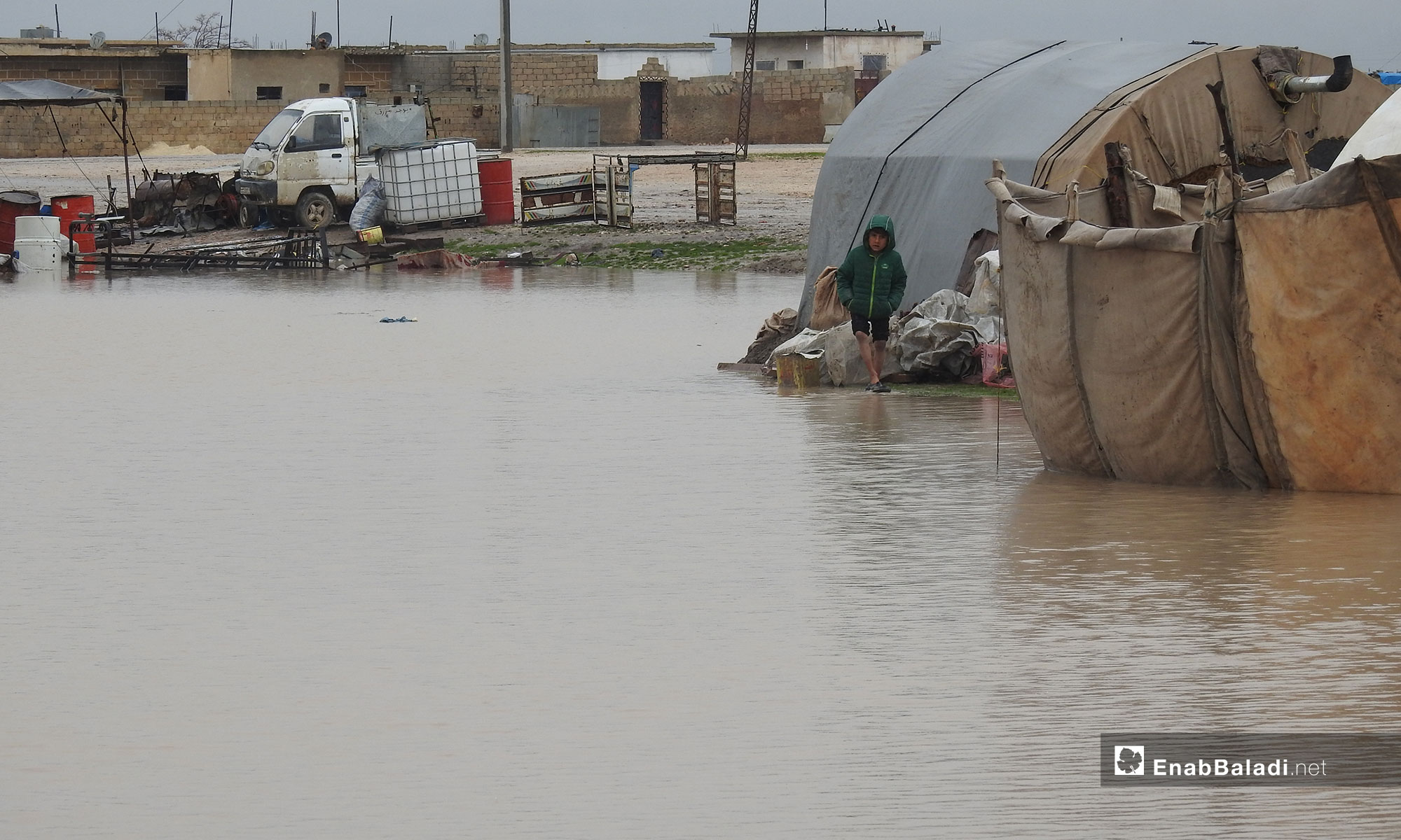 A child at the al-Marj camp, following a rainstorm in northern rural Aleppo – December 27, 2018 (Enab Baladi)