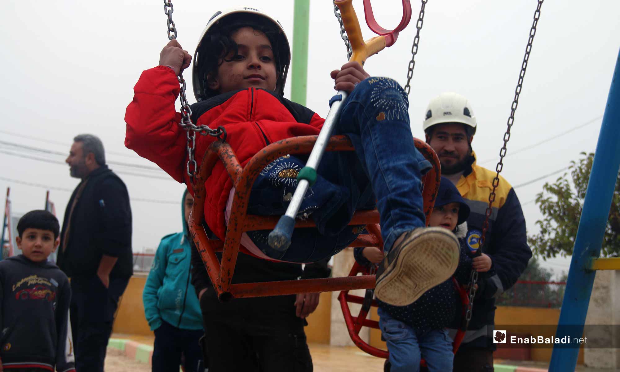 Children play at the al-Dalah Park in the city of Maarrat al-Nu