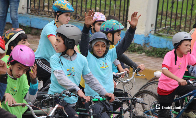 The first kids cycling marathon in Jisr al-Shugur organized by the Syrian Civil Defense - December 11, 2018 (Enab Baladi)