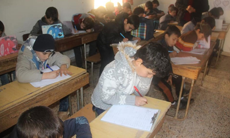 Children during exams in a home class at the town of Haiian, rural Aleppo – December 15 (Haiian Media Office)