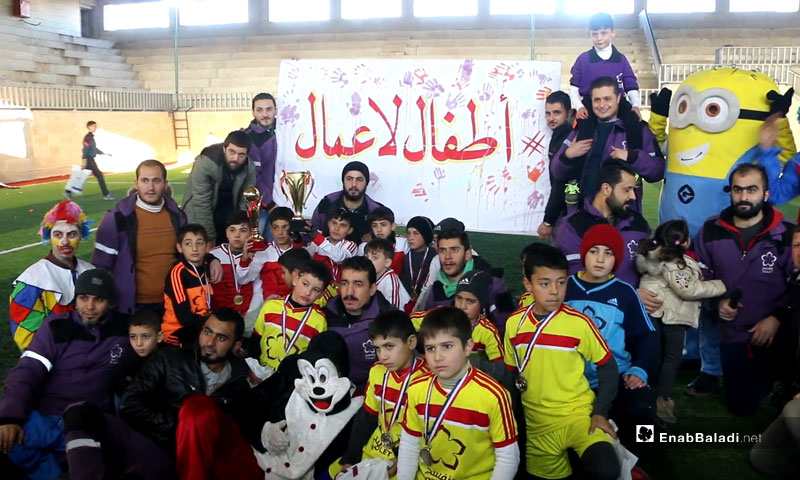“I Have the Right to Play” event in the city of Idlib (the sign says: Children Not Workers) – January 18, 2019 (Enab Baladi)