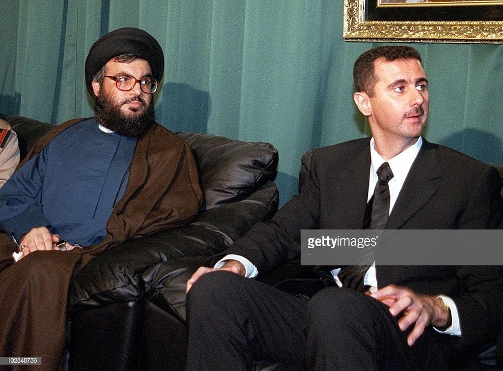 Hezbollah’s Hassan Nasrallah offering Syrian heir president Bashar al-Assad, on June 15 2000, his condolences over the death of his father Hafez al-Assad. AFP/Getty Images.