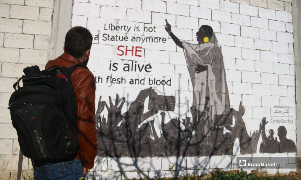 A mural in southern Idlib symbolizing the role of women in the Sudanese revolution – April 11, 2019 (Enab Baladi)
