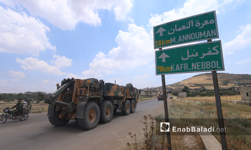 A Turkish military convoy arrives in the Turkish observation post in Shair al-Maghar, western rural Hama – June 15, 2019 (Enab Baladi)