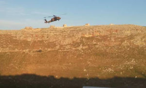 A Turkish helicopter hovering above the observation pots in Shair al-Maghar after its evacuation of wounded Turkish soldiers in northern rural Hama – (Enab Baladi)