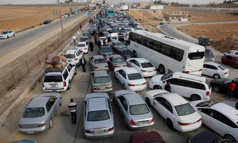 Vehicles awaiting entry into Syria via the Nassib border crossing (Reuters)