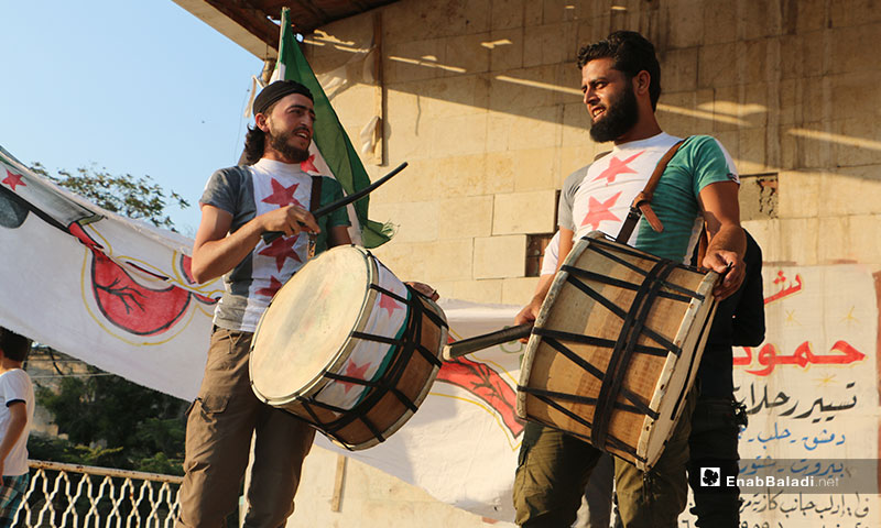 Demonstration held at the Clock Square in Idlib city, demanding the liberation of Khan Shaykhun and offsetting the Syrian regime – September 16, 2019 (Enab Baladi)