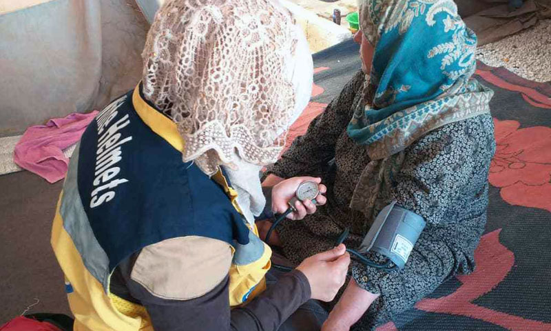 Civil Defense (White Helmets) female volunteers work in al-Ahd camp in Qah village north of Idlib - August 6, 2019 (Civil Defense)