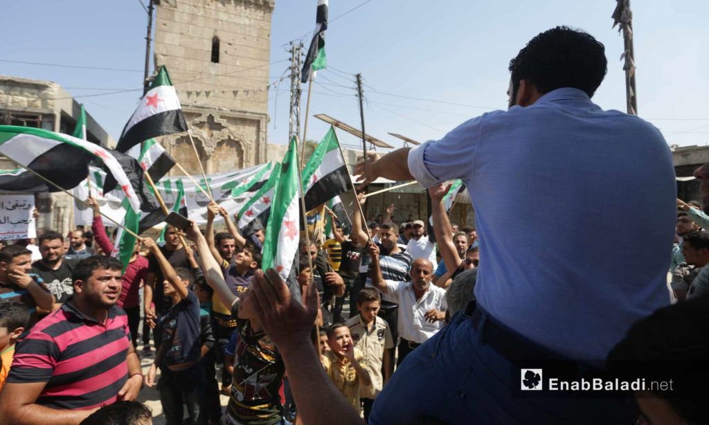 People in Ma`arat al-Nu`man, rural Idlib, protesting against the Sochi deal and demanding the ousting of the Syrian regime – September 6, 2019 (Enab Baladi)