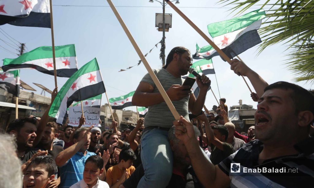 People in Ma`arat al-Nu`man, rural Idlib, protesting against the Sochi deal and demanding the ousting of the Syrian regime – September 6, 2019 (Enab Baladi)