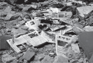 Copies of Enab Baladi newspaper’s 45 issue among the debris of a destroyed building in the city of Daraya, rural Damascus (December 2013) photo credit: Enab Baladi