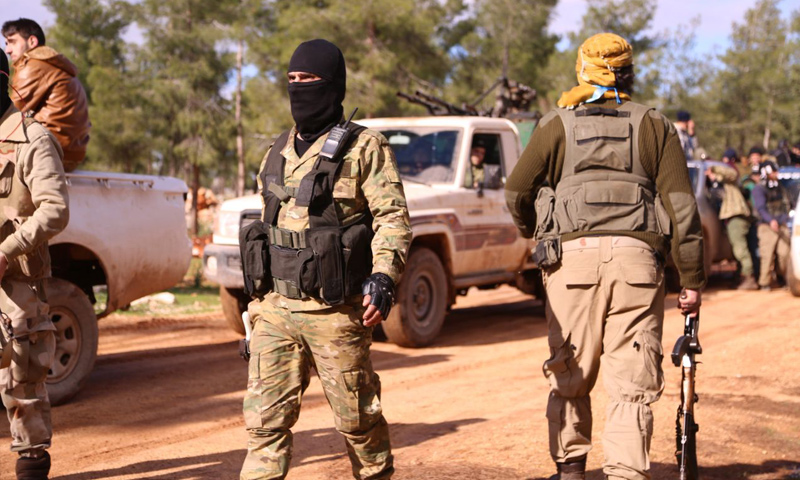 Members of the National Liberation Front (آ/[) as they set off for Tel Mannas - 4 January 2018 (Medad Press)