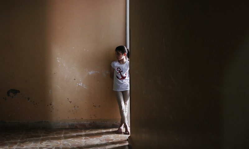 A girl standing in front of her room in an orphanage in Jarablus, northeastern Aleppo - 30 May 2018 (AP)