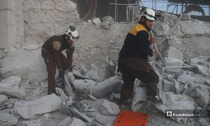 Members of the Syrian Civil Defense help victims of Russian and regime airstrike on the town of Kafr Naha in the western countryside of Aleppo - 21 January 2020 (Enab Baladi)
