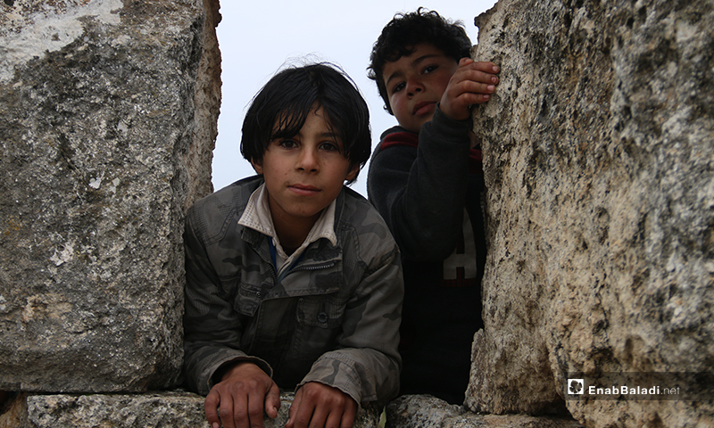 Children playing on Deir Amman ruins in the western countryside of Aleppo - 19 January 2019 (Enab Baladi)
