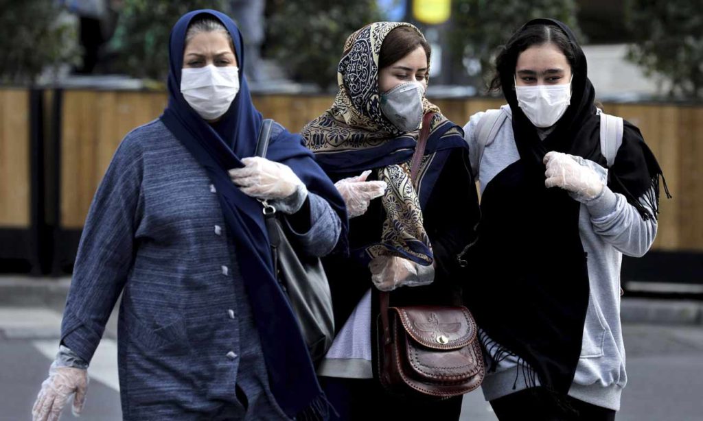 Iranian women committed to the precautionary measures against the spread of the Coronavirus in Iran - 22 February 2020 (Anadolu Agency)