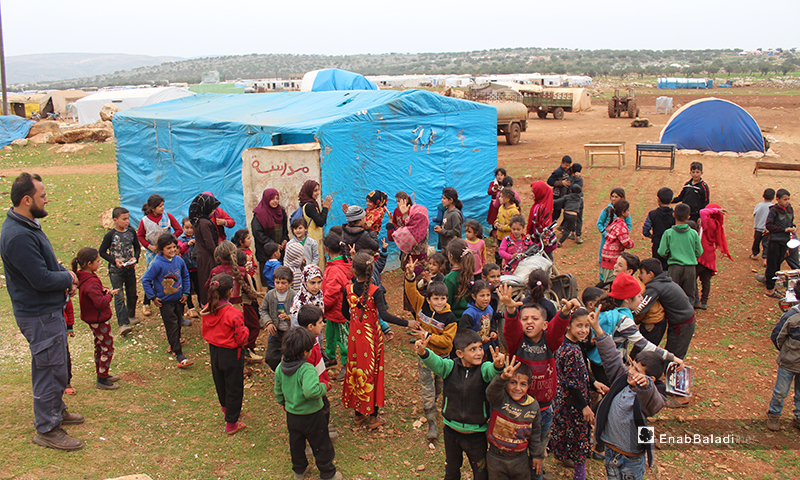 150 Female and male students get education in a worn-out tent in camps east of Kafr Arouk village, north of Idlib - 12 March 2020 
