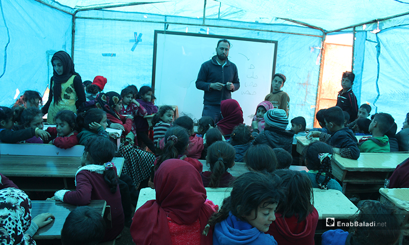 150 Female and male students get education in a worn-out tent in camps east of Kafr Arouk village, north of Idlib - 12 March 2020 
