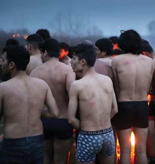 Refugees on the Turkish-Greek border after being stripped of their clothes by Greek forces - 6 March 2020 (TRT)