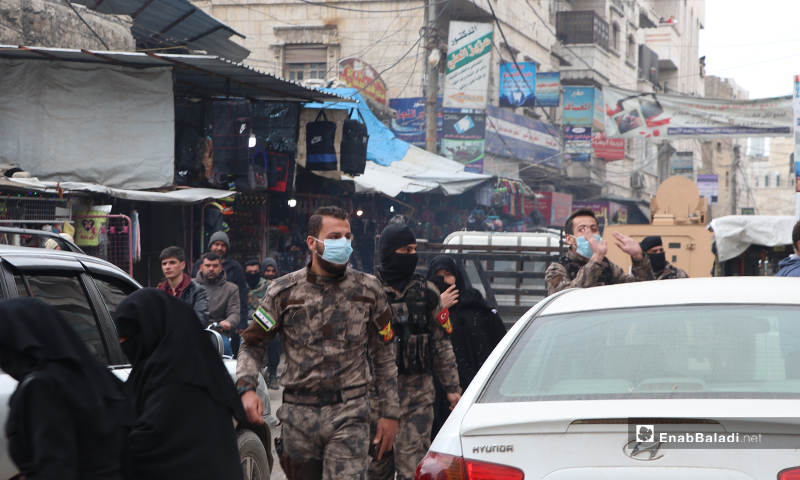 Officers and members of the special forces wearing protective face masks against the novel coronavirus (Covid-19) in the al-Bab city – 28 March 2020 (Enab Baladi)