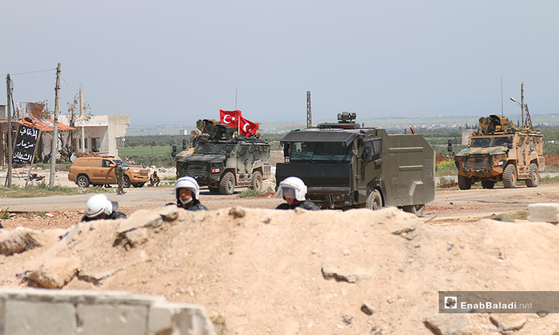Turkish troops and their military vehicles are stationed on the Lattakia-Aleppo international highway (M4) in northern Syria, to safeguard the conduct of the joint patrols with Russia - 17 April 2020 (Enab Baladi) 
