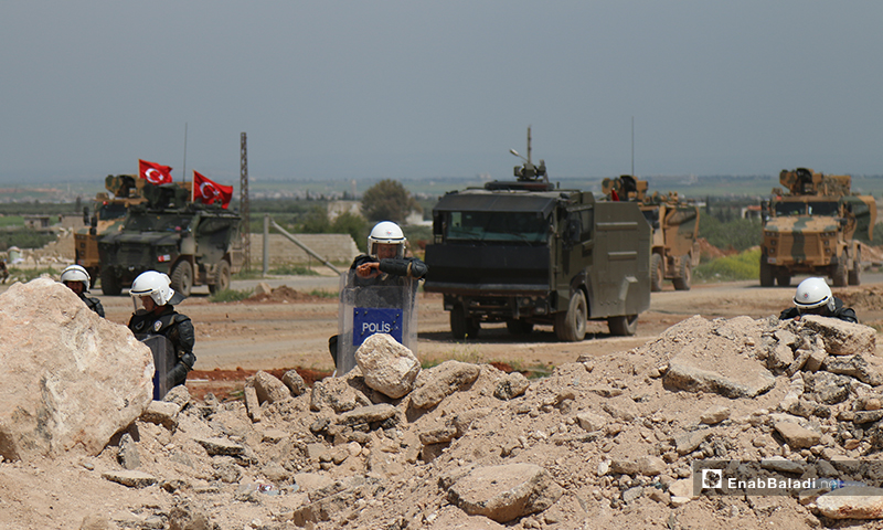 Turkish troops and their military vehicles are stationed on the Lattakia-Aleppo international highway (M4) in northern Syria, to safeguard the conduct of the joint patrols with Russia - 17 April 2020 (Enab Baladi) 
